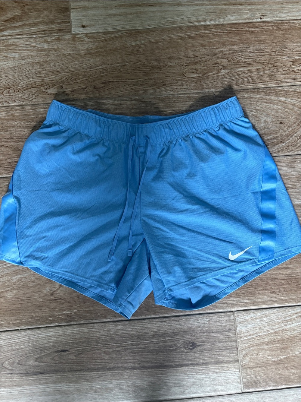 Nike Women's Sky Blue Athletic Shorts with White Swoosh